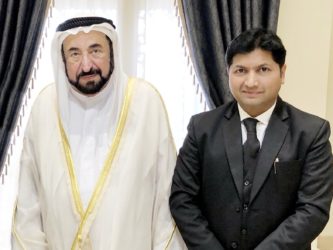 Mujeeb Jaihoon presents SLOGANS OF THE SAGE to Dr. Sheikh Sultan, ruler of Sharjah