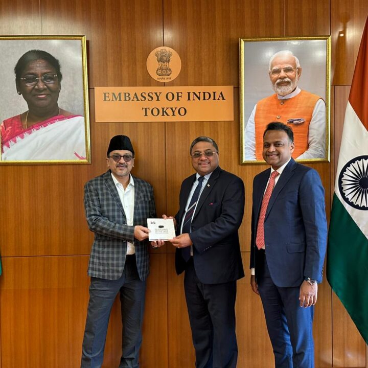 Sadik Ali Shihab Thangal presents Jaihoon's book, Slogans of the Sage, to Sibi George, Indian ambassador to Japan. Also present was Adv. Haris Beeran, Member of Parliament and lawyer at Indian Supreme Court.