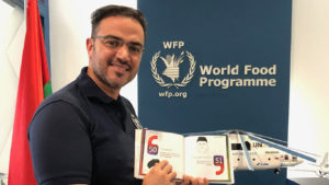 Wasim Samara, UN WFP, with the book, Slogans of the Sage